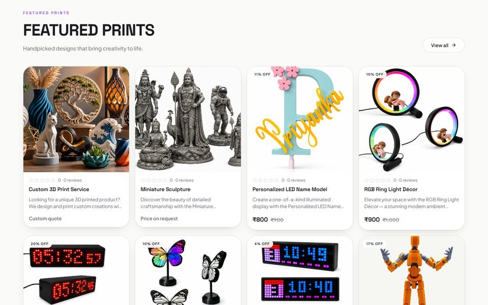 Featured prints grid with product photos, sale prices, and discount badges